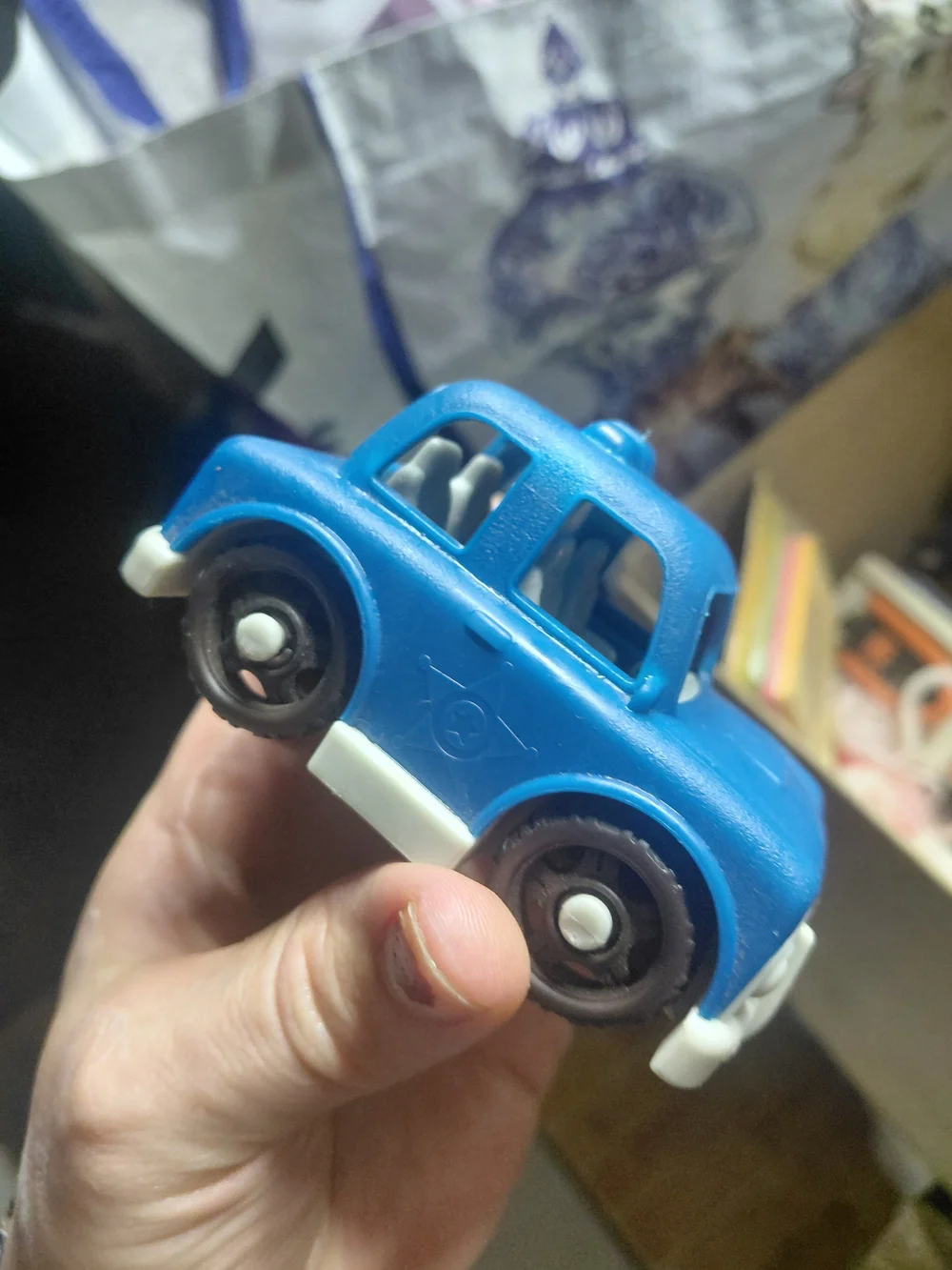 blue and white B. toys Happy Cruisers mini car toy toddlers.  Police car